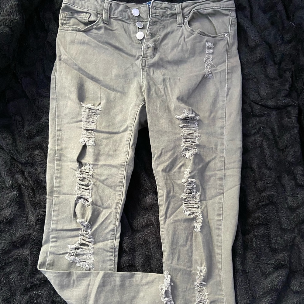 Light army green ripped jeans with split ends